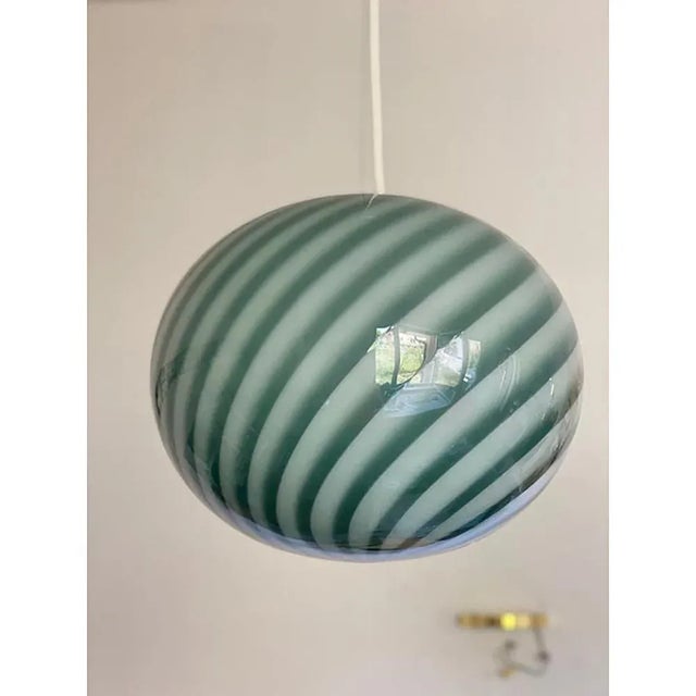 Contemporary green and milky-white oval in murano glass swirl venini style design in very particular and effective...