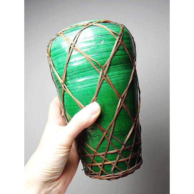 Beautiful and rare Japanese collectible vase in handcrafted green Awaji-yaki ceramic with bamboo weaving, dating from the...