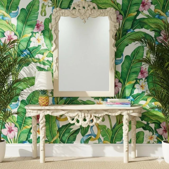 This is a large scale Hollywood Regency style carved Italian mirror with ribbon foliate on both the mirror and table. It...