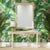 This is a large scale Hollywood Regency style carved Italian mirror with ribbon foliate on both the mirror and table. It...