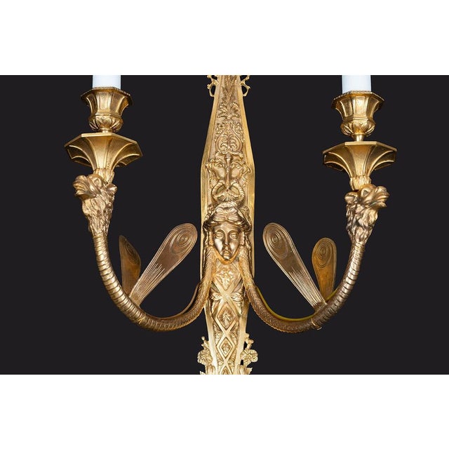 Set of four French gilt-bronze wall sconces dating from the Napoleon III period in the second half of the 19th century....