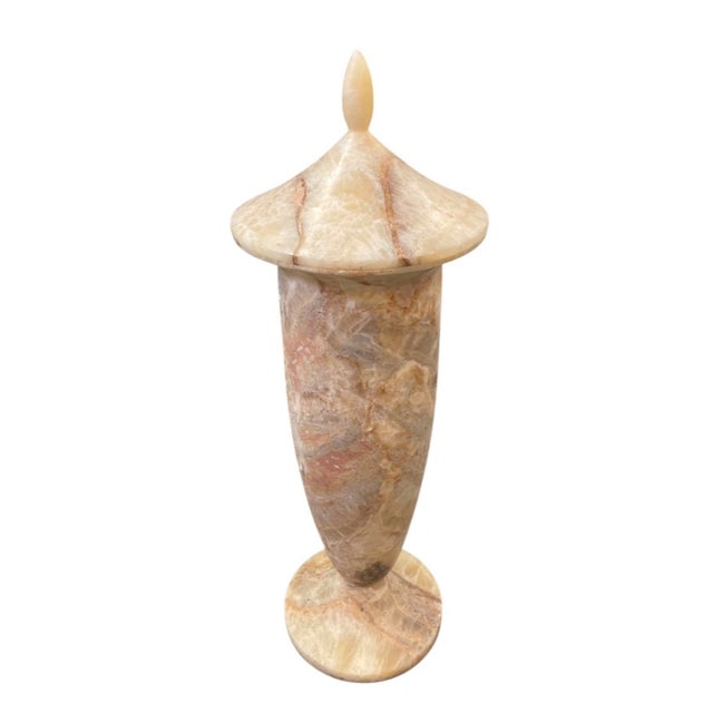 This striking vintage decorative urn is carved from natural onyx marble, showcasing a translucent, multi-layered stone...