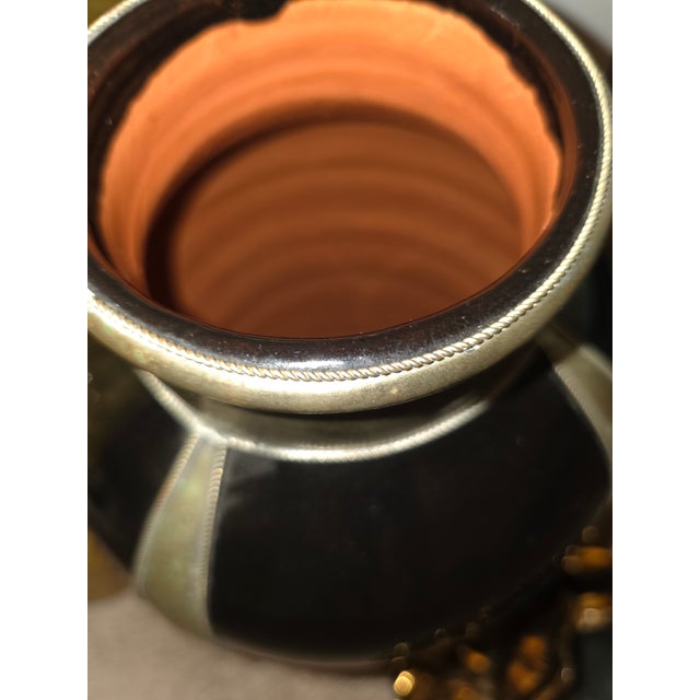 Art Deco style black glazed ceramic/terracotta vase featuring metallic silver accents and banding.Design Details