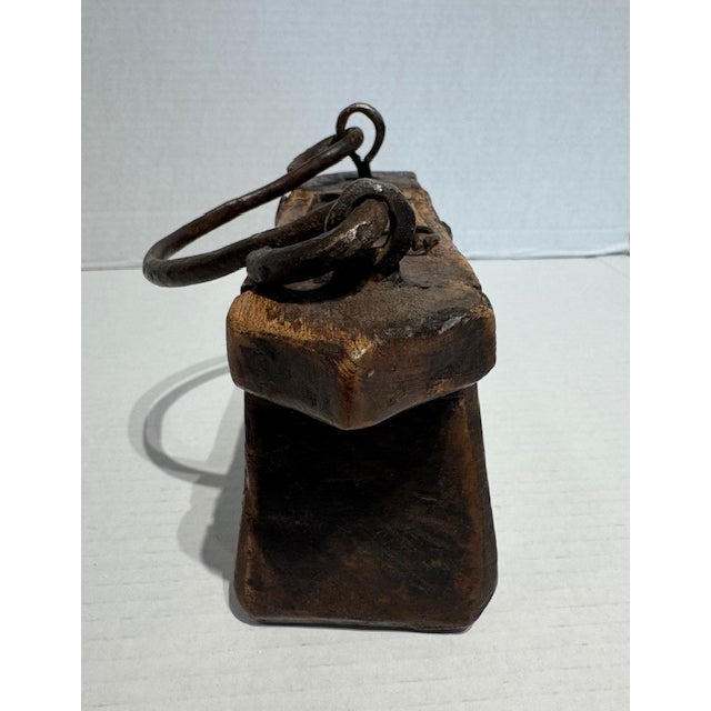This is a beautifully carved, yet functional piece of history. These "purses" were used to carry oil or grease both by...