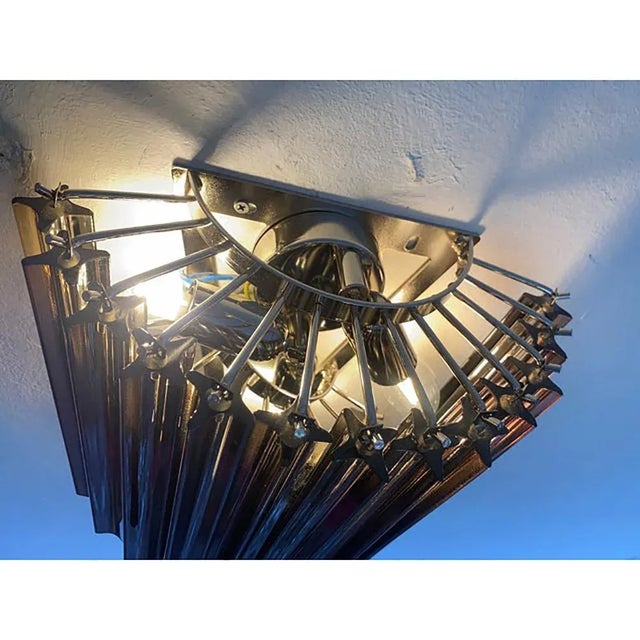 Set of two contemporary elegant "quadriedro" in fumè colour wall sconces. shenographic twister of quadriedro , metal frame...