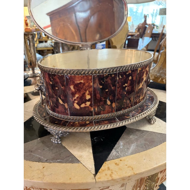 Elevate your dressing table or vanity set with this magnificent Regency-style oval box. Splendidly clad in segmented faux...