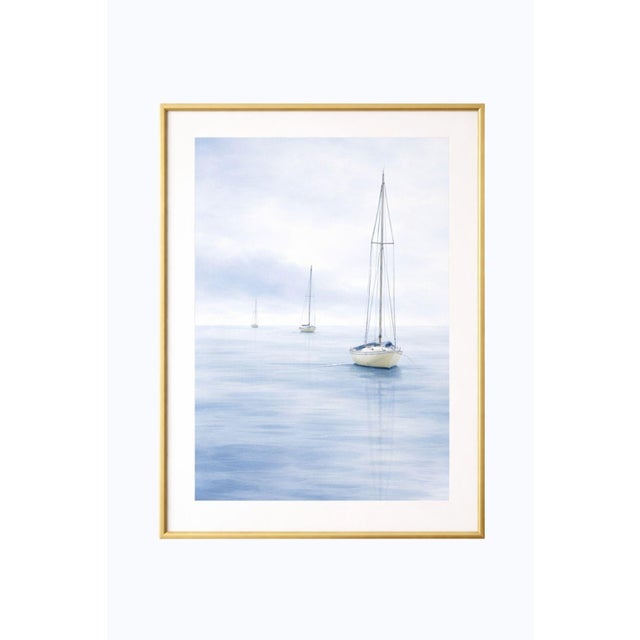 Minimalist coastal artwork featuring three sailboats drifting across a calm, misty horizon. Soft watercolor tones and...