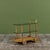 Gilbert Rohde maple bar cart, c.1940s, USA for Herman Miller. This playful piece features two glass shelves and one maple...