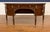 This is the Lillian Sideboard by Maitland - Smith. It has traditional styling with a curved front, Brass Lion pulls and...