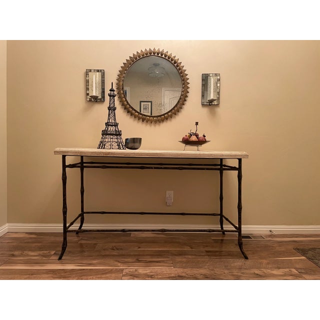 Add a touch of European country side with this Ironies Console Table. There is an airiness with the simple metal bamboo...