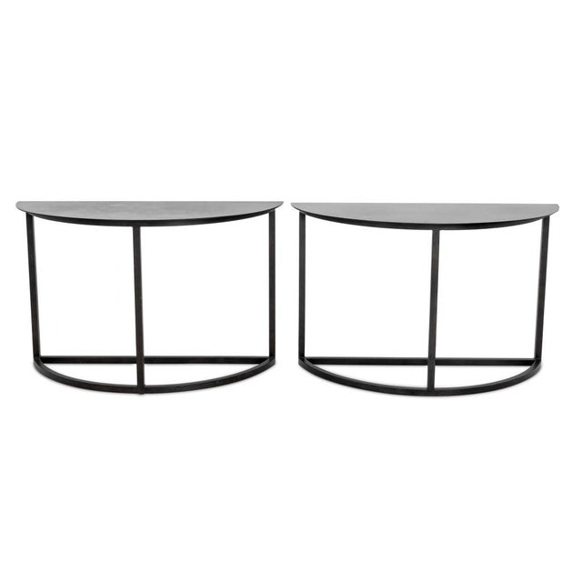 Pair of Minimalist Black Metal Demilune Tables. Provenance: From an Upper East Side Collection. Each: D. Provenance: From...