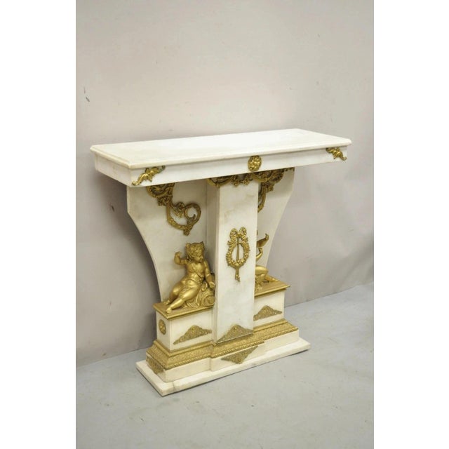 Antique French Louis XV Style Marble and Bronze Ormolu Console Table with Cherubs. Item features 2 full figured cherubs,...