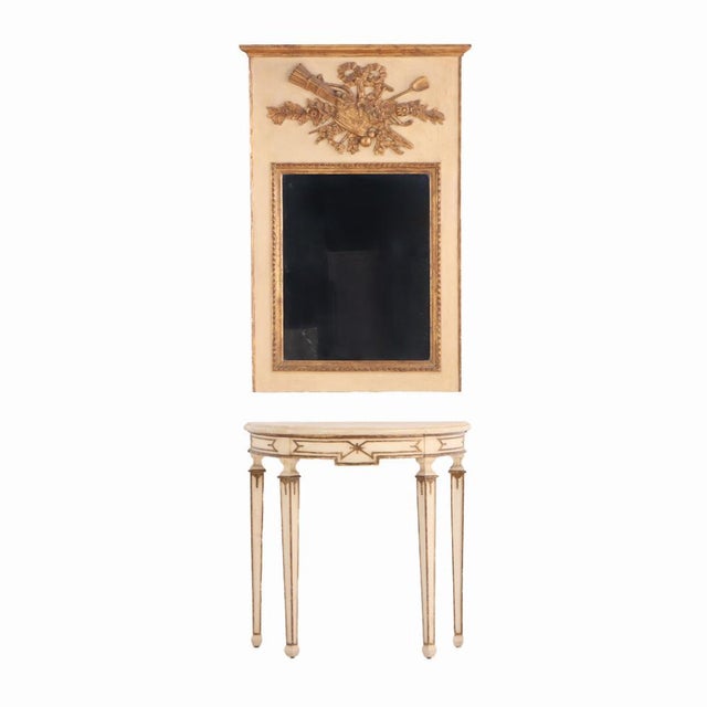 The large rectangular Trumeau mirror with stepped cornice over beautifully carved motifs of bow, basket of flowers,...