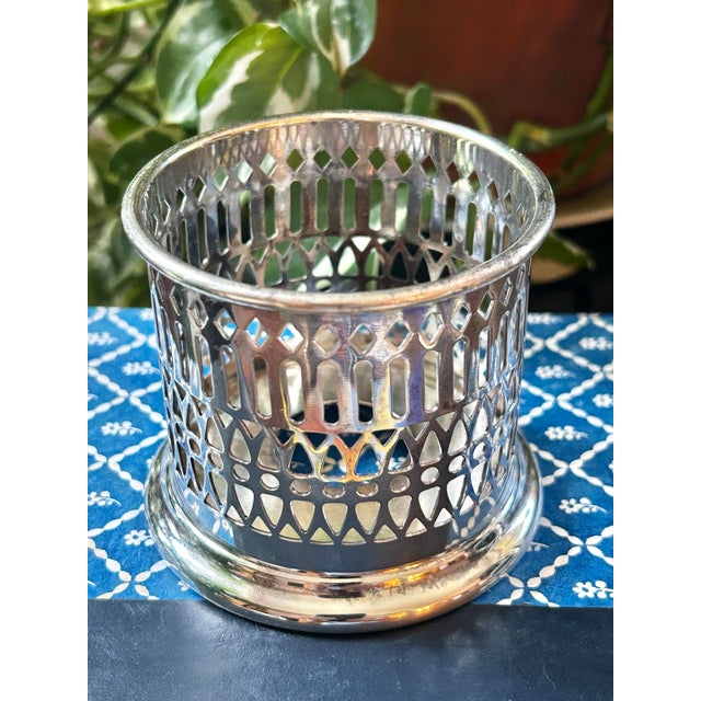 Add old world charm to your table setting with this silver plate over copper condiment holder or jar sleeve. From the...