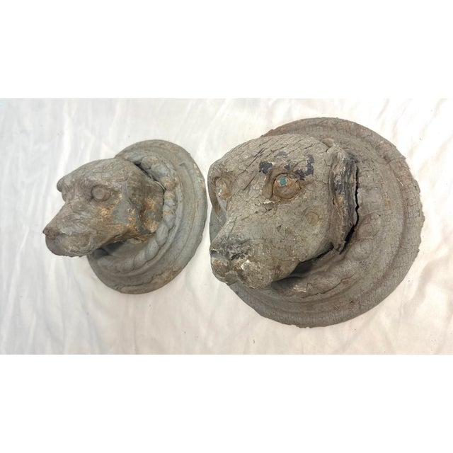 Up for sale is an exquisite pair of antique architectural salvage hand-carved wooden dog sculptures from Conklin Port...