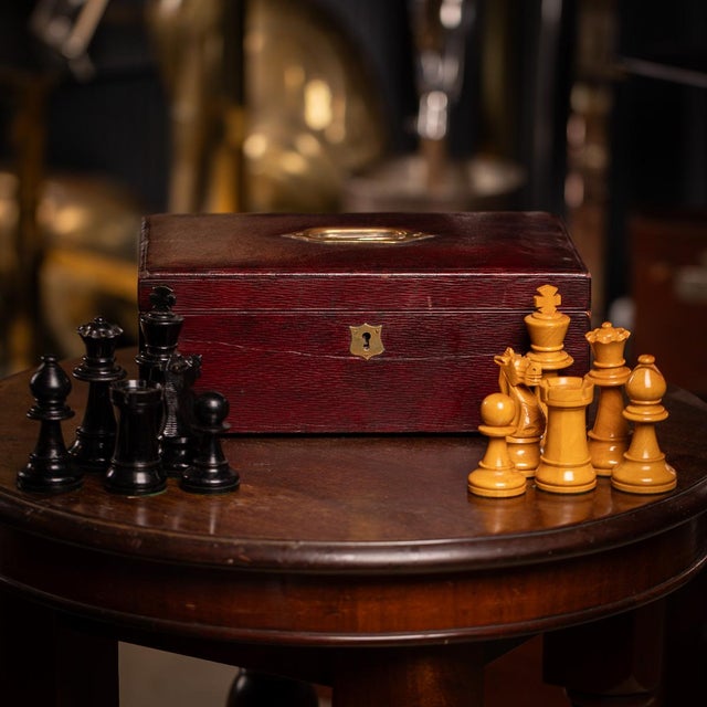 Vintage 20th century boxwood chess set by staunton. The pieces are carved from boxwood in natural wood and black. Comes...