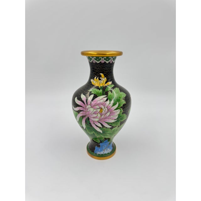 Beautiful black cloisonné vase with pink, green and yellow floral details. The black background makes the beautiful...