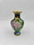 Beautiful black cloisonné vase with pink, green and yellow floral details. The black background makes the beautiful...