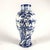 A Taccini family white and blue ceramic vase from Vinci, 1976, featuring a richly decorated lake landscape with boats, all...