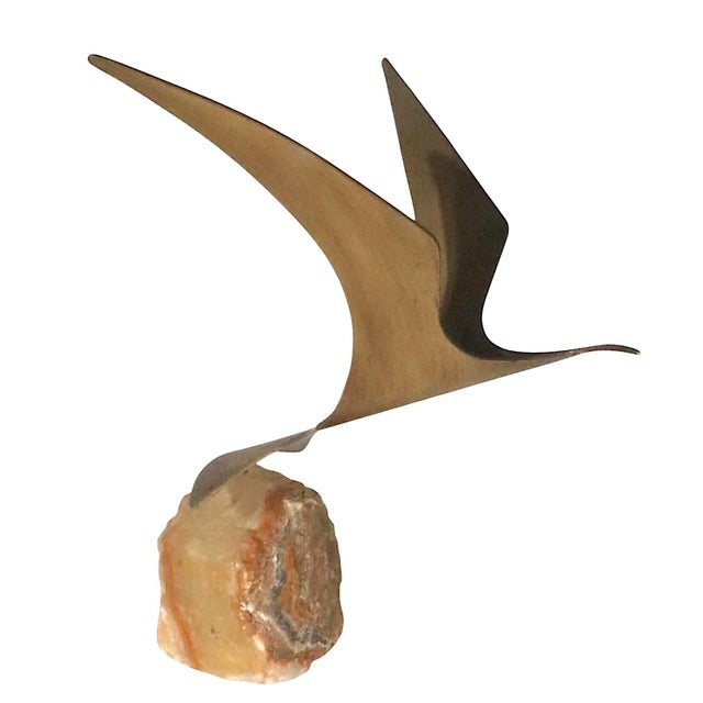 Brutalist Seagull in flight sculpture signed CJere 1980. Sinuous metal bird anchored on organic onyx stone base.
