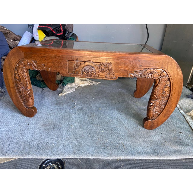 This Antique Chinese Hand Carved Coffee Table is a stunning piece of furniture originating from China in the early 1900s....