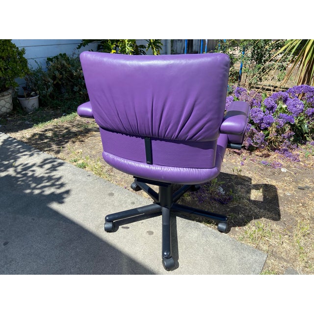 The 1990s Mario Bellini Vitra Figura Post Modern Purple Leather Desk Chair is a stunning piece of furniture that embodies...