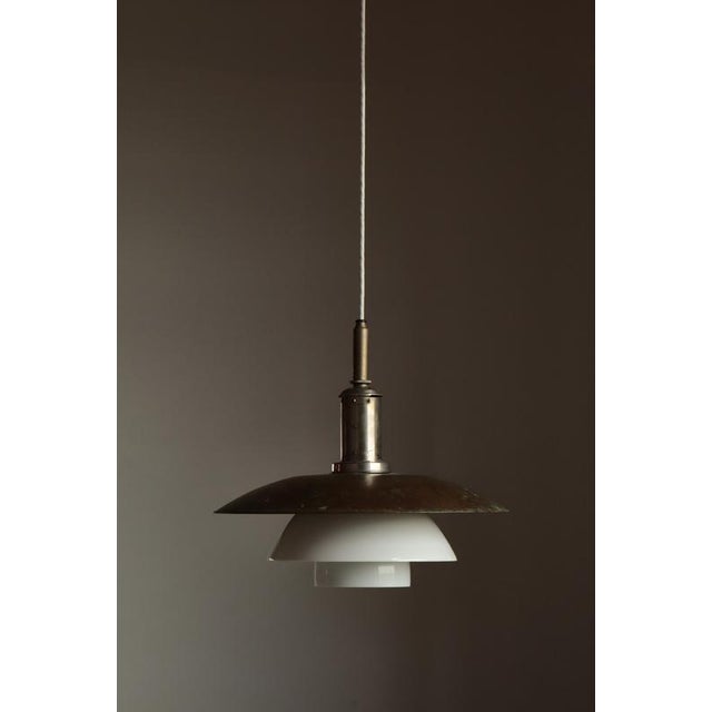An exceptional and increasingly rare early example of poul henningsen’s iconic ph 4/4 pendant, dating to the early 1930s....
