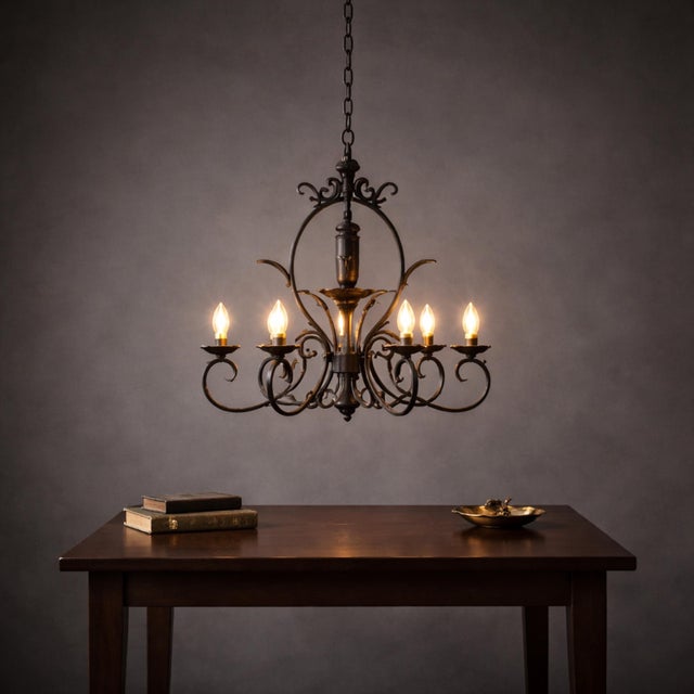 Product Description: Make a dramatic historic statement with this exceptional 5-arm hand-forged wrought iron chandelier....
