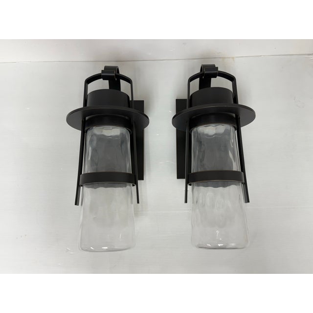 Design Plus Gallery presents a Pair of the Balthus Outdoor Sconces from Modern Forms. Inspired by vintage lantern forms,...