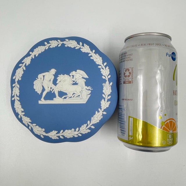 This is a mid-century Wedgwood blue jasperware lidded trinket box. It features a beautiful blue and white design with...
