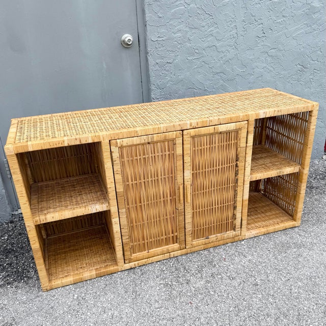 This vintage blonde wicker credenza brings natural texture and relaxed bohemian charm to any interior. Its clean...