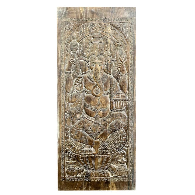 Bring divine artistry into your home with this Vintage Indian Carved Ganesha Barn Door Wall Accent. Handcrafted from...