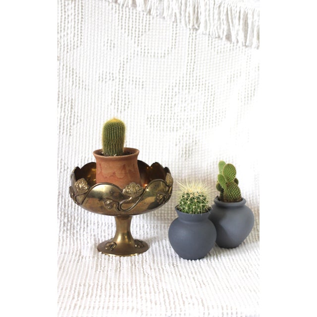 Dramatic pedestal planter or bowl with a pedestal base and lurid designs. I can see this for keys, jewelry or as a...