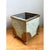 This vintage painted metal cache pot pairs a soft pale green finish with charming shell motifs, a combination that brings...