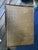 An English burnt bamboo two-tier side table with its original grass cloth, top and bottom. The grass cloth on the top has...