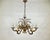Step into a realm of unparalleled elegance with this breathtaking French bronze chandelier from the 1960s. More than just...