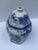 Hexagon shape ginger jar with varying hand painted blue fruit, flora and border designs on white ground. The dome top lid...