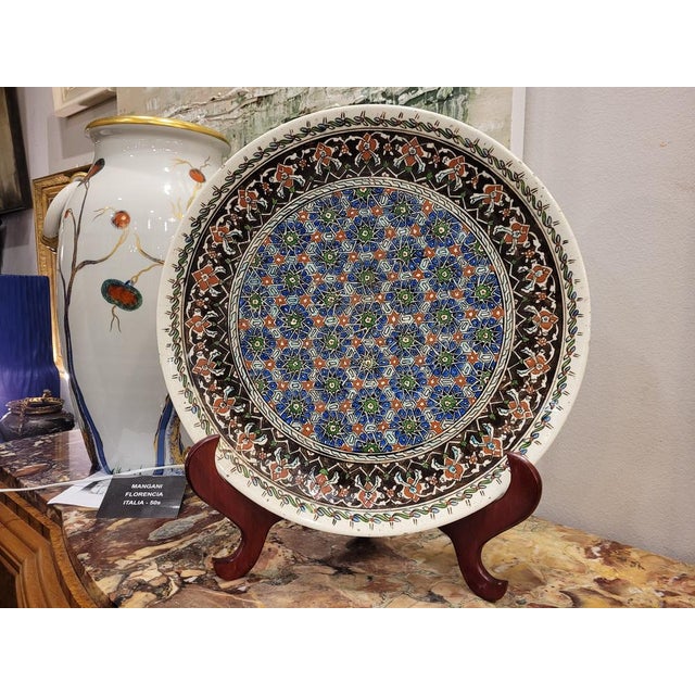 Decorative Turkish ceramic dish typical of the city of Kütahyya with oxide painted design. This piece exhibits a striking...