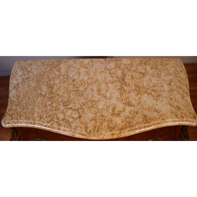 We are pleased to offer this beautiful Antique French Louis XV commode, from the 1920. This commode is made satinwood...