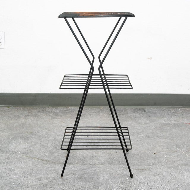 Unique 1950s square metal plant stand for outdoors, garden or indoors. The piece is well maintained throughout and can...