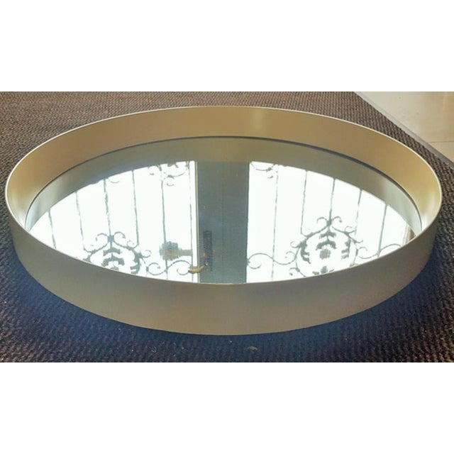 Round Mid-Century wall mirror, with a white frame, Italy, 60s.