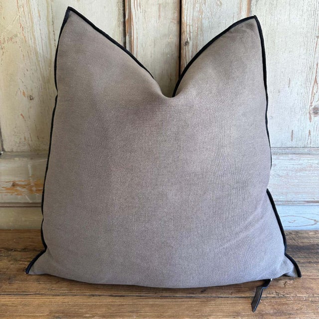 Linen blend accent pillow. Color: Ecorce / lavender - grey colored nubby textured stone washed linen pillow with a black...