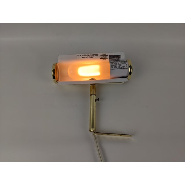 Elegant vintage picture light by Angelo Lighting, featuring a compact 7-inch profile and bright polished brass-tone...