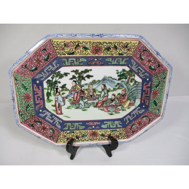This porcelain platter is hand painted with raised enamel decoration in a Familie Rose pattern. The platter is octagon...