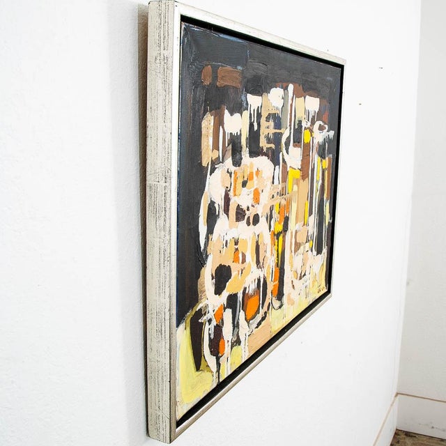 Mid sized modern abstracted expressionist oil painting signed on the bottom right corner. Colors throughout include...