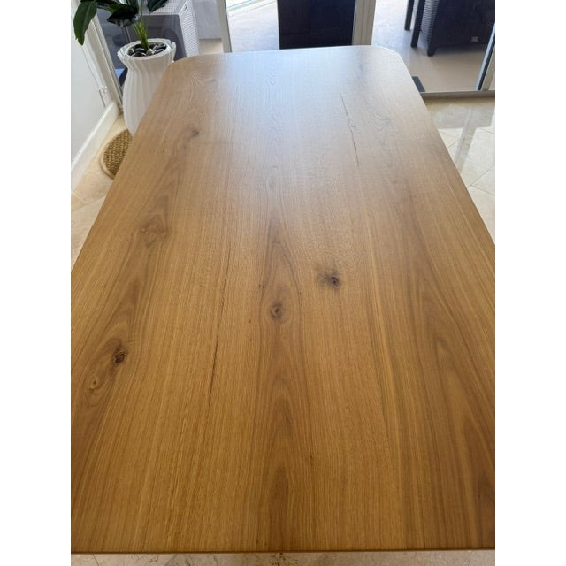 This Restoration Hardware Oslo 72" Oak Dining Table is a sculptural modern classic, celebrated for its architectural base...