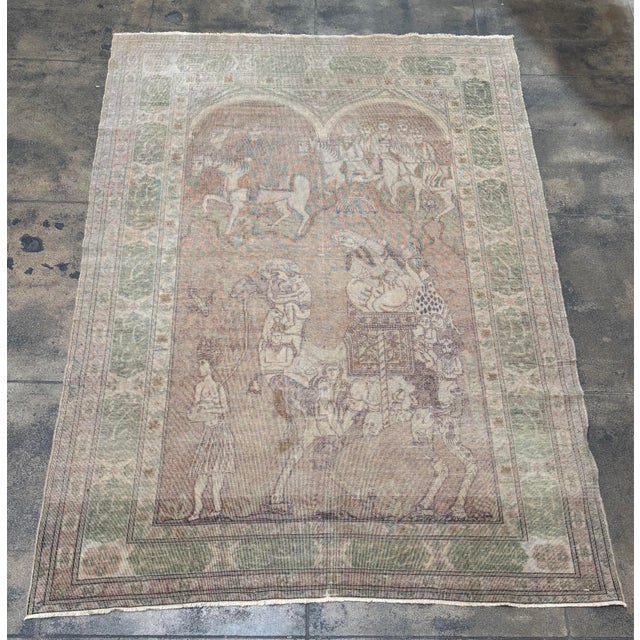 An exceptional mid 19th century Turkish silk rug featuring an elaborate figural and narrative composition. The central...