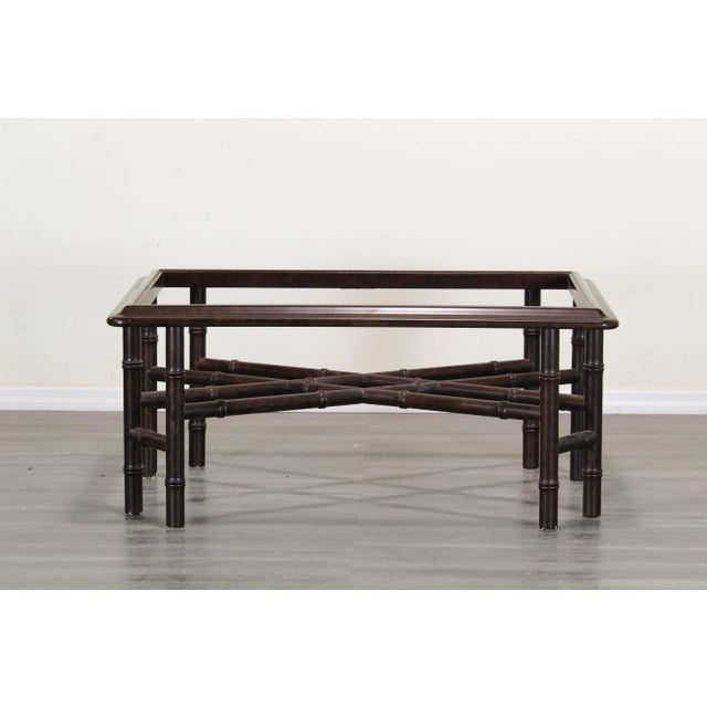 Vintage Faux bamboo coffee table with glass top This coffee table have a some light scratches and scuff marks This table...