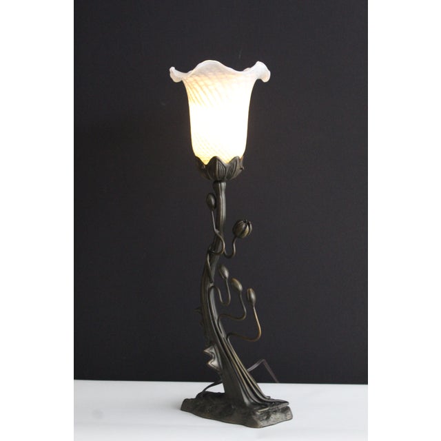 Unusual Art Nouveau Sculptural piece. Graceful flowing lines. Befitting the Art Nouveau style. Topped with a opalescent...