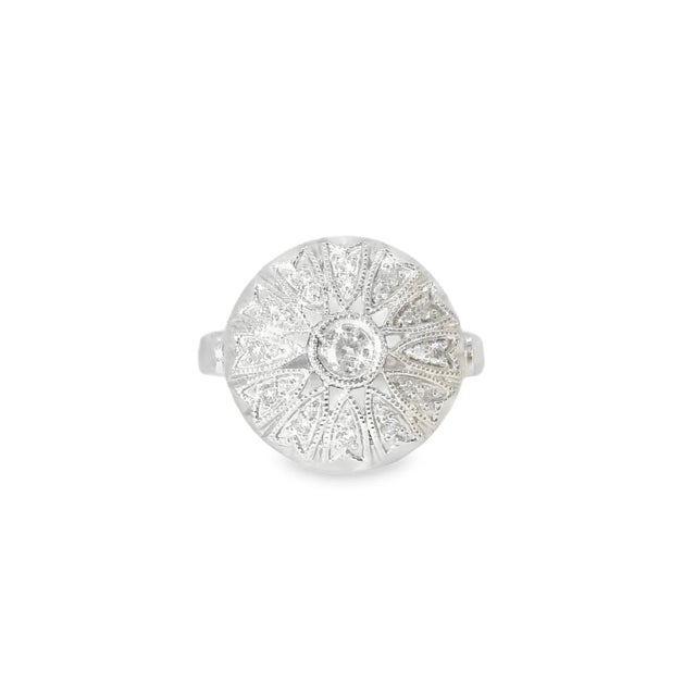 This elegant antique estate cocktail ring is crafted in 14K white gold and showcases numerous brilliant round diamonds...